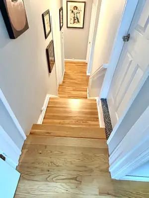 Wooden staircase with wall art